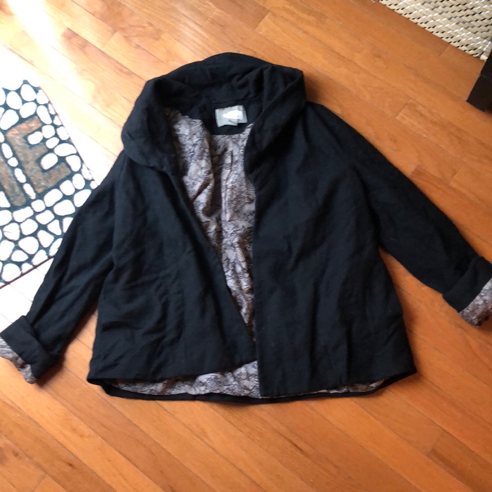 Black jacket with unique cuff.